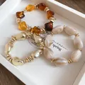 Retro geometric beaded bracelets with amber and marble textures in a white tray - Geometric Marble Pattern Bracelet Set (23) / Three-Piece Set / Gold-Coffee-Khaki