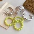 Fashionable set of silver geometric bangles and vibrant neon yellow beaded bracelets - Fluorescent Yellow Bead Bracelet Set (45) / 6-Piece Set / Silver-Cyan