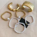 Elegant vintage gold chunky bangles and white pearl beaded bracelet jewelry set for women - Striped Wide Pearl Bracelet Set (49) / 7-Piece Set / Gold-White-Pearl Style