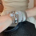 Vintage silver and pearl stacked bracelet set with metallic cuff and bead accents - Silver Textured Pearl Bracelet Set (50) / 7-Piece Set / Silver-White-Pearl Style