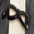 Pince à cheveux banane noire brillante en forme de nœud pour queue de cheval chic - Style Nœud / Noir Brillant