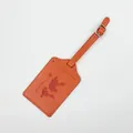 Premium orange leather luggage tag featuring an embossed world map and airplane design - Luggage Tag / Orange