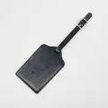 Black leather luggage tag with embossed world map and adjustable silver buckle strap. - Luggage Tag / Black