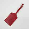 Elegant red faux leather luggage tag featuring an embossed world map and airplane detail - Luggage Tag / Red