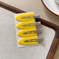 Set of four vibrant yellow seamless hair clips with professional duckbill grip design - Plastic Style / 1 Piece / Yellow