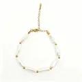 Detailed macro view of baroque pearl bracelet with gold spacer beads on white background - Elegant Baroque Bead (423)