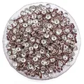 Pile of silver rondelle spacer beads with pink rhinestones for DIY bracelet making - Purple