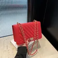 Elegant red chevron quilted small square bag with golden lock and chain shoulder strap - Red