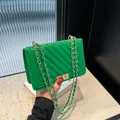 Elegant vibrant green quilted shoulder bag with gold chain and turn-lock closure for women - Green
