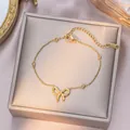 Elegant gold-tone titanium steel bracelet featuring a delicate bow charm and beads - Bead Bowknot Bracelet / Gold