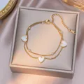 Double-layered gold titanium steel bracelet with white heart charms and crystals - Double Layer White Shell Heart (B5018)