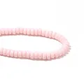 Close-up detail of light pink polymer clay flat round spacer beads for DIY jewelry - Light Pink