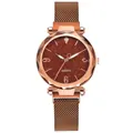 Close-up of women's starry sky dial watch with rose gold magnetic Milanese band - Coffee