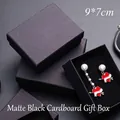 Close-up of minimalist black cardboard jewelry boxes with 9x7cm dimensions - No Logo Black Jewelry Box / 9cm x 7cm