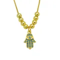 Detail of gold-plated Hamsa hand pendant necklace with blue zircon accents - Hamsa Hand (DN260602-F)