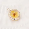 Round glass pendant with a real yellow dried flower and gold frame - Yellow Dried Flower Pendant