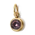 Close-up macro view of a elegant gold bezel pendant with a faceted purple birthstone - June Birthstone (6mm)