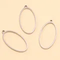 Gros plan sur trois cadres ovales en acier inoxydable pour la création de bijoux DIY - Ovale - Grand / 14X28X1.2mm / Acier