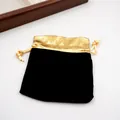 Elegant black velvet jewelry pouch with metallic gold trim and drawstring closure - 9*12 Black Gold Velvet Pouch / 9*12cm