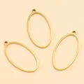 Gros plan de trois montures de pendentifs ovales en acier doré pour bijoux DIY. - Ovale - Grand / 14X28X1.2mm / Or