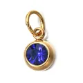 Close-up of golden stainless steel pendant with round blue faceted birthstone - September Birthstone (6mm)