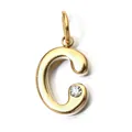 Close-up detail of a gold stainless steel letter C pendant with a clear birthstone. - Letter C