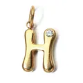 Detailed macro shot of gold stainless steel letter H pendant with clear birthstone accent. - Letter H