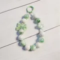 Pastel green and white beaded keychain charm with a cute bow decoration for bags - Green