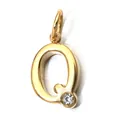 Close-up of gold-plated stainless steel letter Q pendant with sparkling birthstone detail - Letter Q