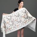 Elegant white winter shawl for women featuring colorful floral embroidery and long tassels. - Embroidered Snowdrop Flower - White / 70-200cm