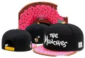 Trendy snapback hat with 'THE Munchies' embroidery and pink donut-patterned brim - Style - 162 / Adjustable