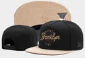 Stylish black and beige snapback cap with Barber Brooklyn embroidery and flat brim - Style-147 / Adjustable