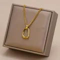 Close-up of a gold-colored geometric pendant on a minimalist stainless steel chain necklace - Geometric Hollow Style (26A06010-4)