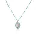 Detailed macro view of turquoise beaded chain with silver Virgin Mary pendant necklace - Platinum Teal Rhinestone