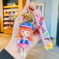 Schattige anime schoolmeisje sleutelhanger met paarse PVC-band en gouden belletje - Chibi Oranje Staartjes Meisje / Paars