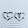 Detailed view of silver heart-shaped stainless steel hoop earrings with unique inner loop - 18K Gold / Silver Spiral Heart (097)