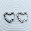 Detailed view of silver heart-shaped stainless steel earrings with unique hammered texture - 18K Gold / Silver Hammered Texture Heart (094)