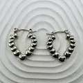 Textured silver-toned stainless steel bubble hoop earrings with stylish C-shaped design - 18K Gold / Silver Bubble Hoop (100)