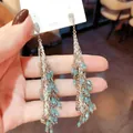Bohemian style long tassel earrings featuring blue crystal beads and silver needles - Silver Earring Post - Silver - Tassel