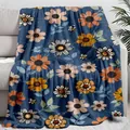 Soft navy blue floral throw blanket with daisy and bee print draped on a white sofa. - ALKJ11 / 75*100 [source Factory]