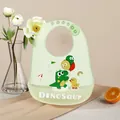 Adjustable waterproof silicone baby bib with a cute dinosaur print in soft green color - Balloon Dinosaur
