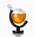 Detail of elegant globe whiskey decanter with internal glass ship on a wooden stand. - 850ml Wine Bottle + Wooden Stand; Transparent