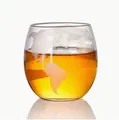 Elegant globe etched whiskey glass with amber liquid on a white background with reflection - 250ml Single Wine Glass; Transparent