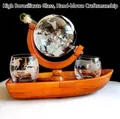 Globe whiskey decanter set with an antique ship inside and a wooden boat stand - 850ml Wine Bottle + Wooden Sailboat + 2 X 250ml Glasses; Transparent