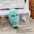 Detailed view of the green face-shaped squeeze toy with dimensions and weight info. - Male Alien