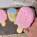 Realistic pink popsicle squishy toy for stress relief with colorful sprinkles - Strawberry Molten Ice Cream