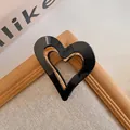 Vintage black heart-shaped hair claw clip with elegant golden interior for women - Black