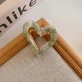 Vintage heart-shaped hair claw clip with green marble acetate and gold frame - Green