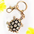 Elegante schildpad sleutelhanger met strass en zwarte emaille in gouden afwerking - Black Enamel Series