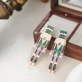 Fashionable nutcracker soldier drop earrings with white pearls and colorful enamel finish - Green Pink Blue and Black Style (E32044-2)
